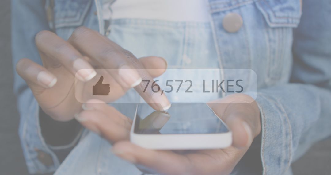 Close-up of Hands Using Smartphone with Social Media Likes Popup