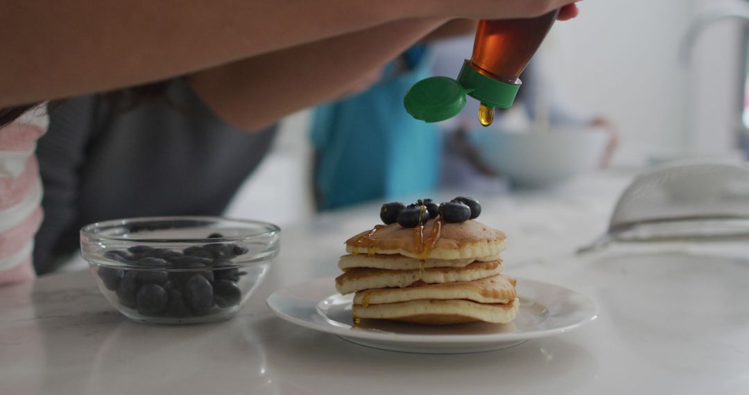 Close-Up of Pancakes with Syrup and Blueberries on White Plate - Free Images, Stock Photos and Pictures on Pikwizard.com