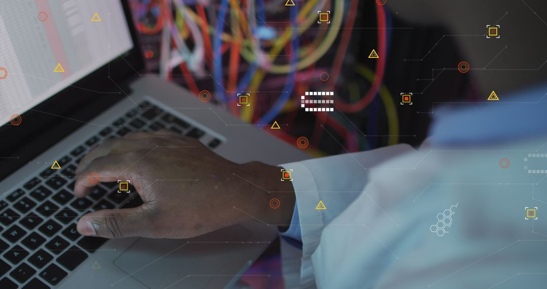 Engineer Analyzing Data on Laptop in Server Room
