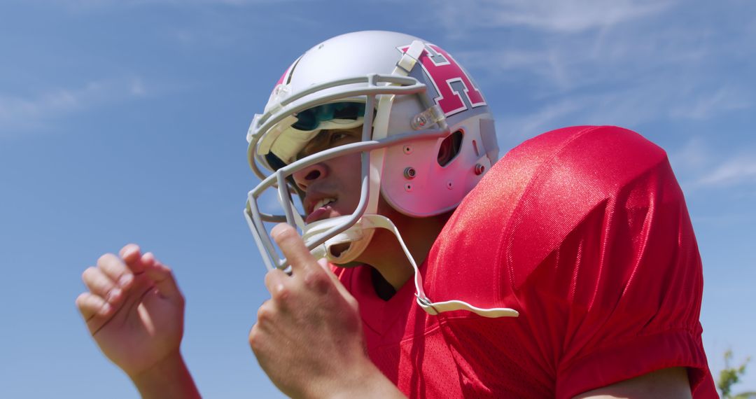 American Football Player in Red Jersey and Helmet - Free Images, Stock Photos and Pictures on Pikwizard.com