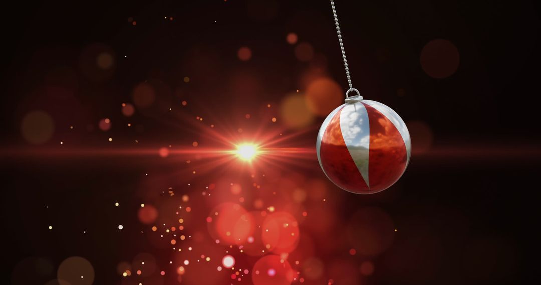 Floating Christmas Bauble with Starry Red Background - Free Images, Stock Photos and Pictures on Pikwizard.com