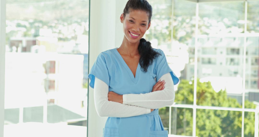 Confident Nurse Smiling in Modern Hospital - Free Images, Stock Photos and Pictures on Pikwizard.com