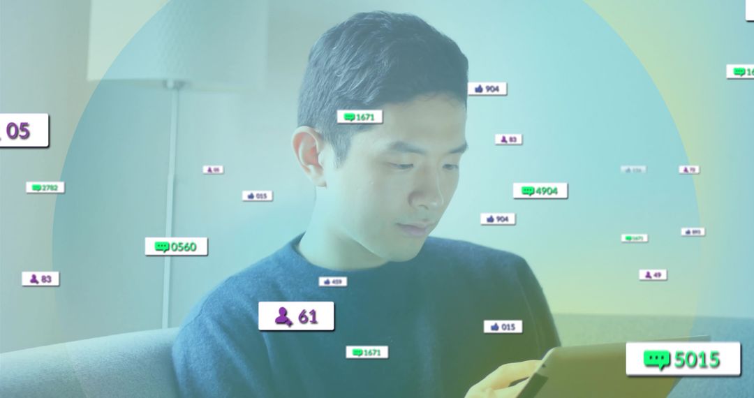 Asian Man Engaging with Digital Technology on Tablet at Home