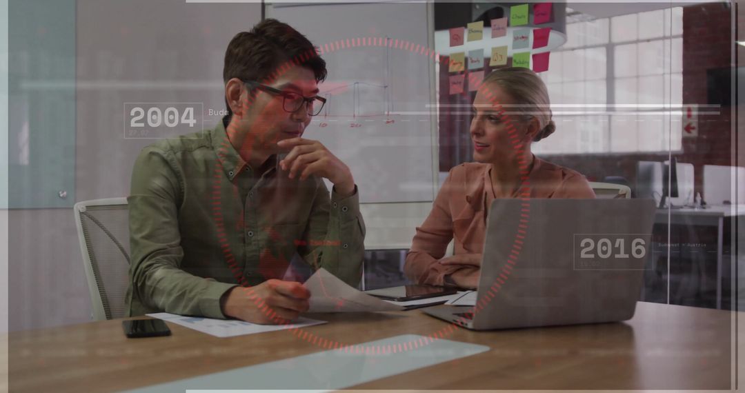 Business Colleagues Collaborating with Technology in Modern Office