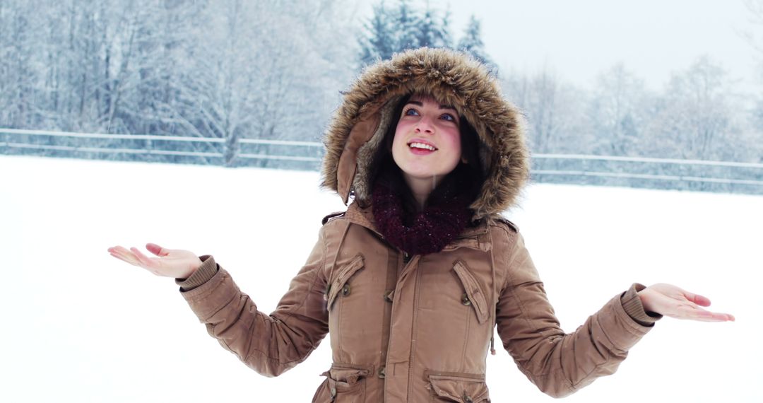 Woman Enjoying Winter Snow in Park with Warm Coat - Free Images, Stock Photos and Pictures on Pikwizard.com