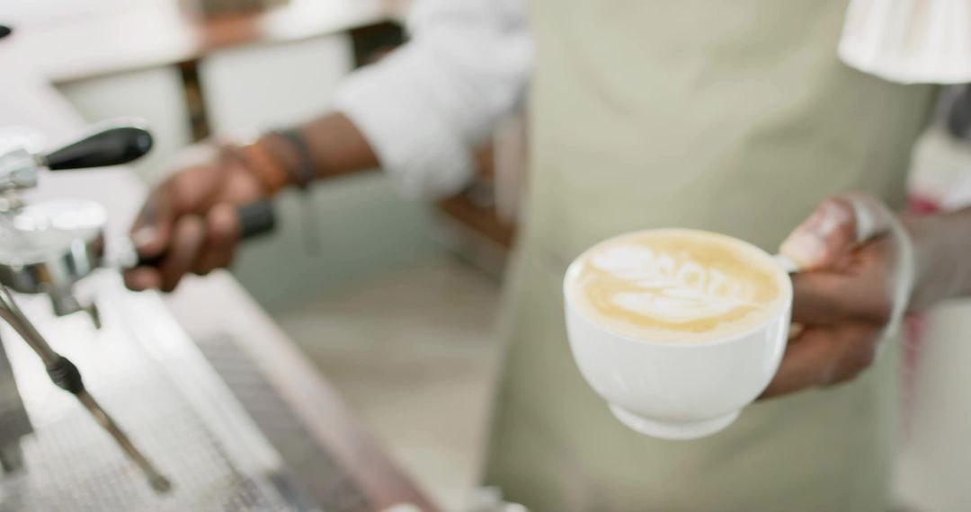 Barista Crafting Perfect Latte Art at Coffee Counter