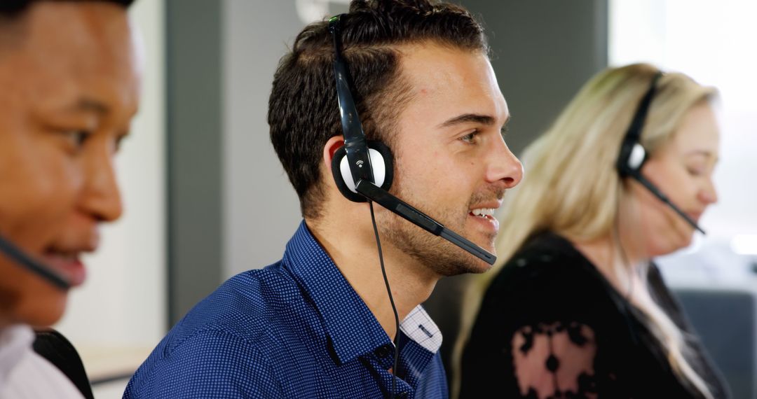 Customer Service Team Wearing Headsets Working in Office - Free Images, Stock Photos and Pictures on Pikwizard.com