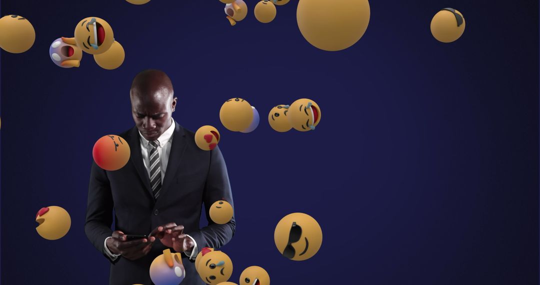 Businessman Engaged on Smartphone with Floating Emojis Around