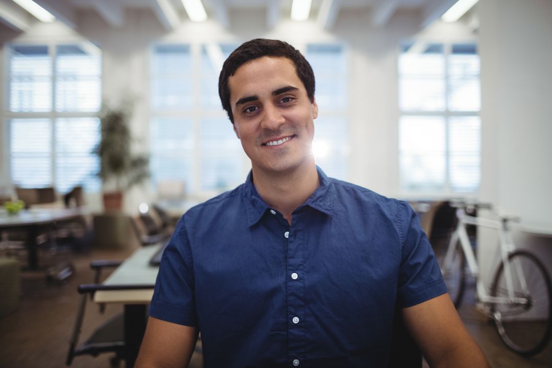 Relaxed Professional Smiling in Modern Open-Plan Office