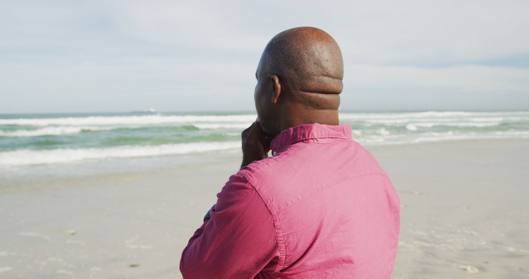 Thoughtful Man Enjoying Tranquil Ocean View at Beach - Free Images, Stock Photos and Pictures on Pikwizard.com