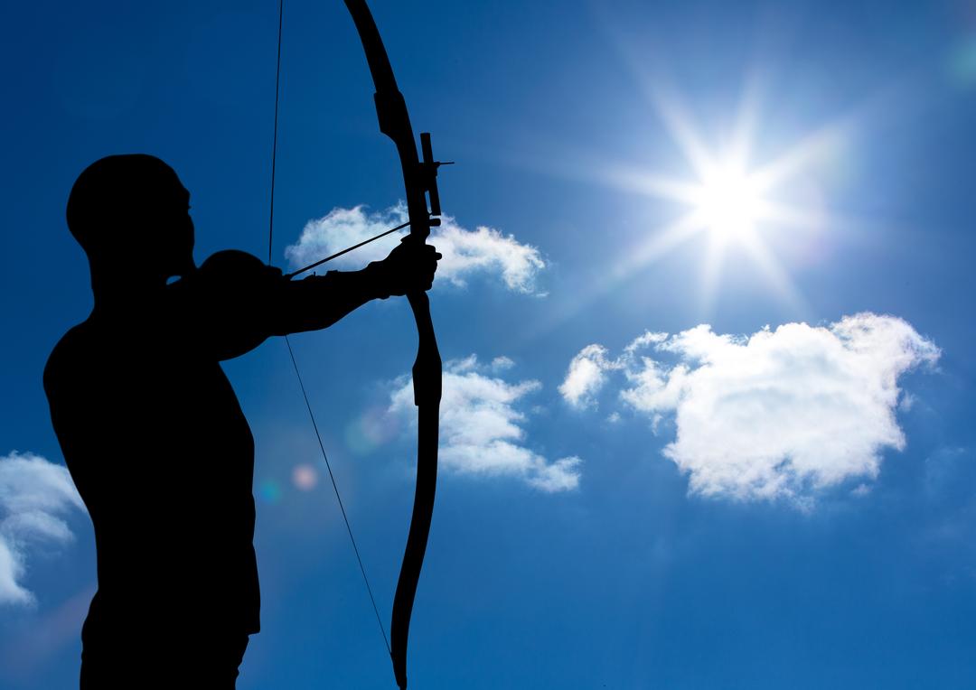 Silhouette of Archer Aiming Bow at Bright Sun - Free Images, Stock Photos and Pictures on Pikwizard.com