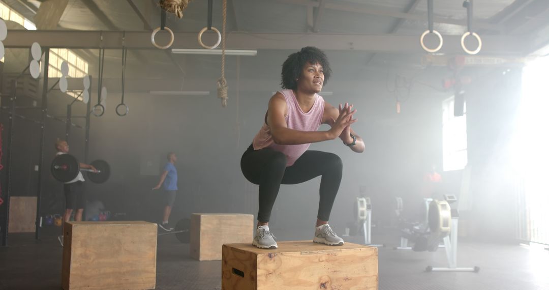 Woman Performing Box Jumps in Gym - Free Images, Stock Photos and Pictures on Pikwizard.com