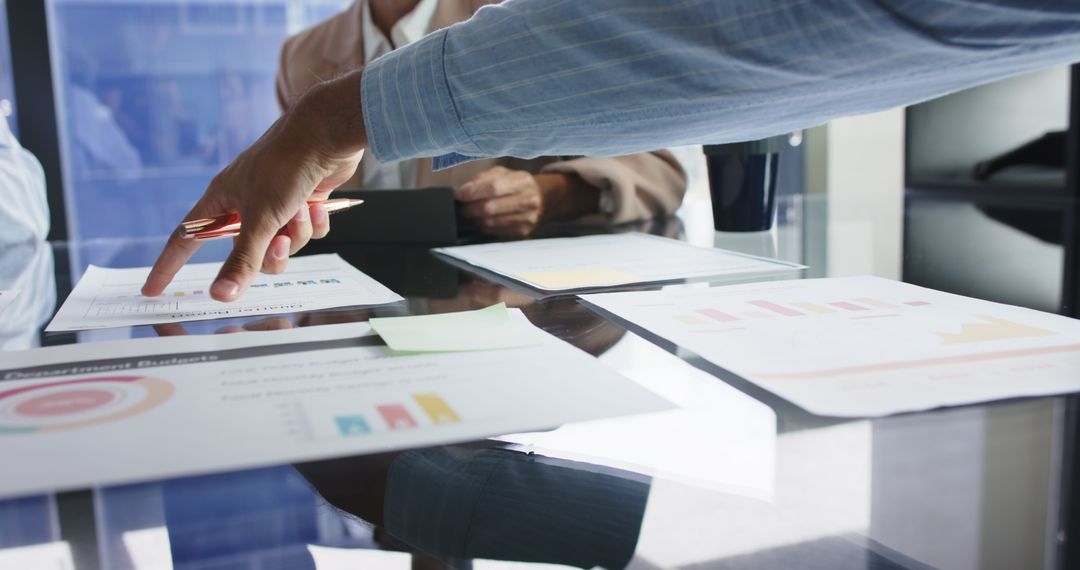 Business Team Analyzing Financial Documents in Office Meeting