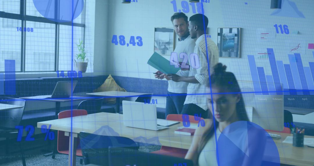 Business Colleagues Analyzing Data in Modern Co-Working Space