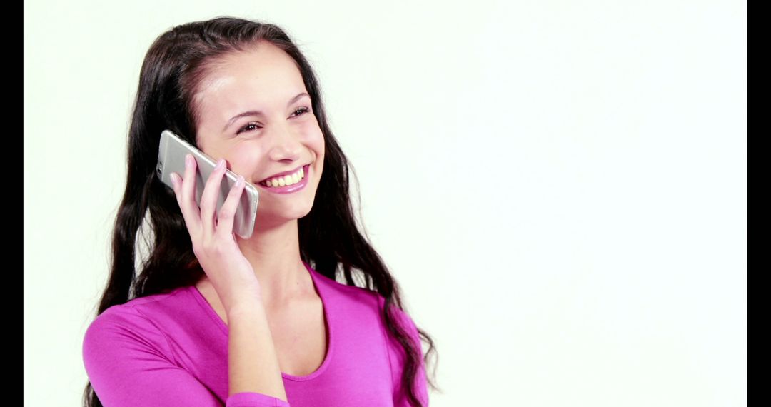 Smiling Woman in Pink Top Talking on Smartphone Indoors - Free Images, Stock Photos and Pictures on Pikwizard.com