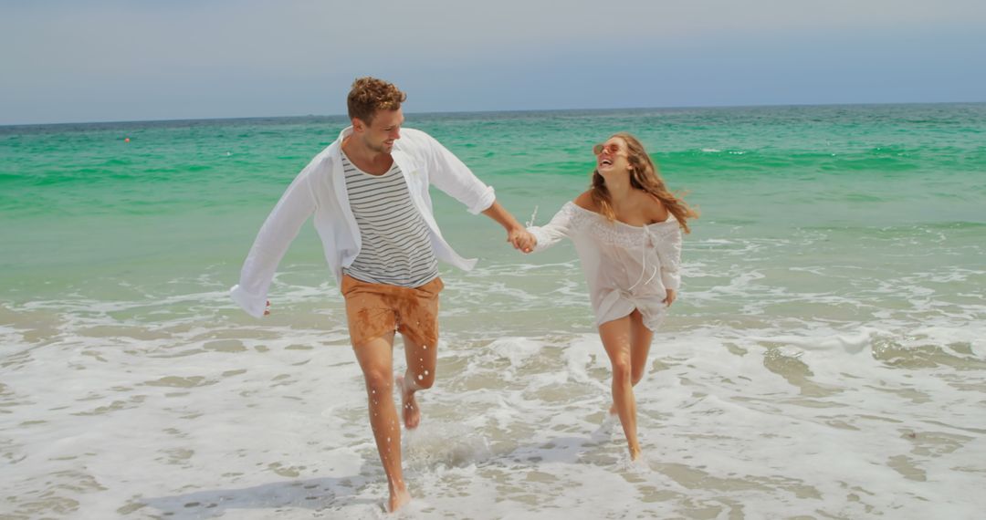 Joyful Couple Running on Sunny Beach Day