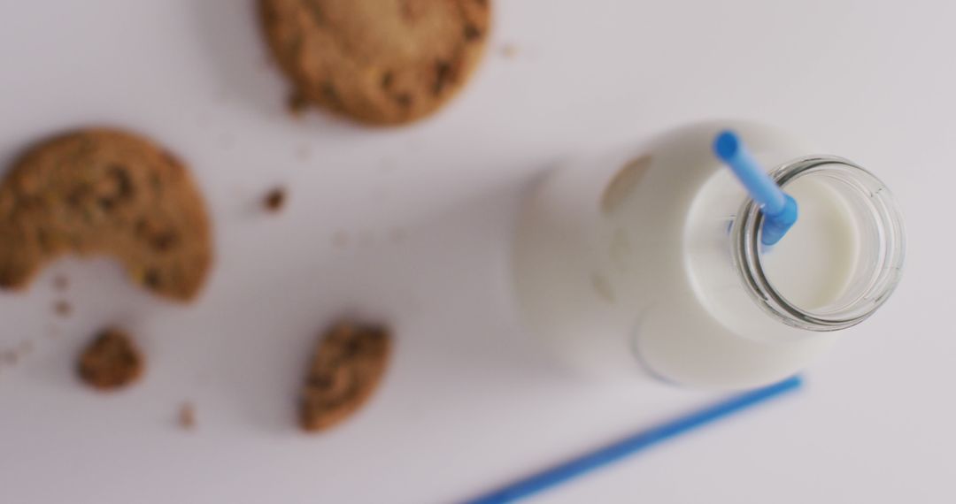 Milk Bottle and Cookies on White Background - Free Images, Stock Photos and Pictures on Pikwizard.com