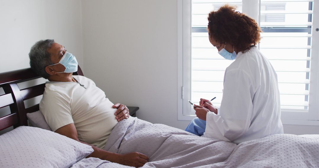 Healthcare Worker Caring for Elderly Patient at Home - Free Images, Stock Photos and Pictures on Pikwizard.com