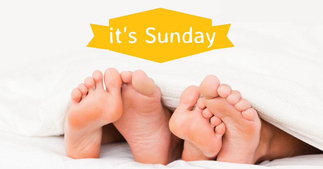Relaxed sunday morning with cozy feet under blanket