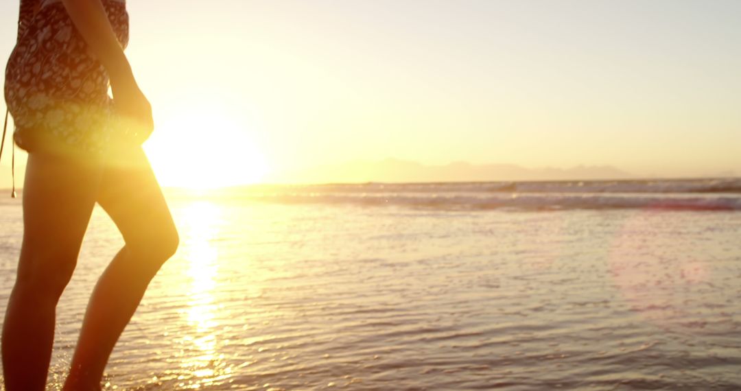 Person Enjoying Serene Beach Sunset - Free Images, Stock Photos and Pictures on Pikwizard.com