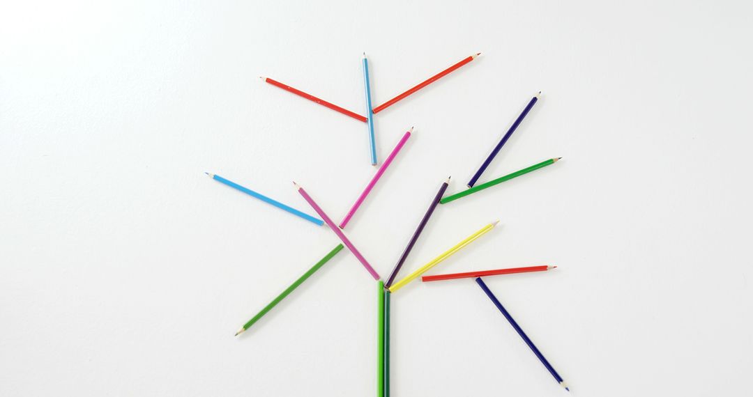 Color pencils arranged in tree shape on white background for creative art concept - Free Images, Stock Photos and Pictures on Pikwizard.com