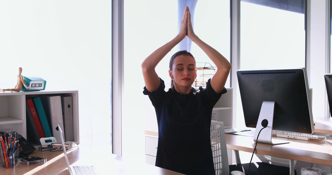 Woman Practicing Office Yoga for Relaxation at Work - Free Images, Stock Photos and Pictures on Pikwizard.com