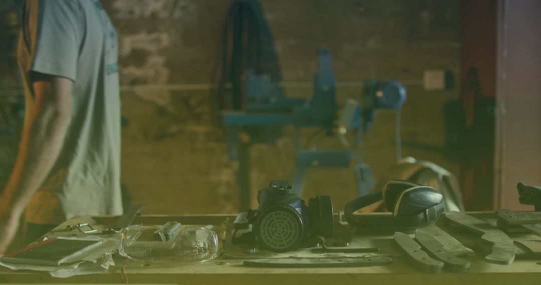 Workshop Tools with Protective Gear and Worker