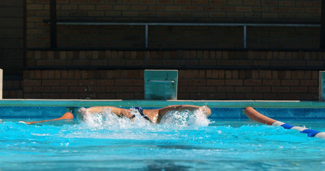 Athletic Swimmer Practicing Freestyle Strokes in Pool - Free Images, Stock Photos and Pictures on Pikwizard.com