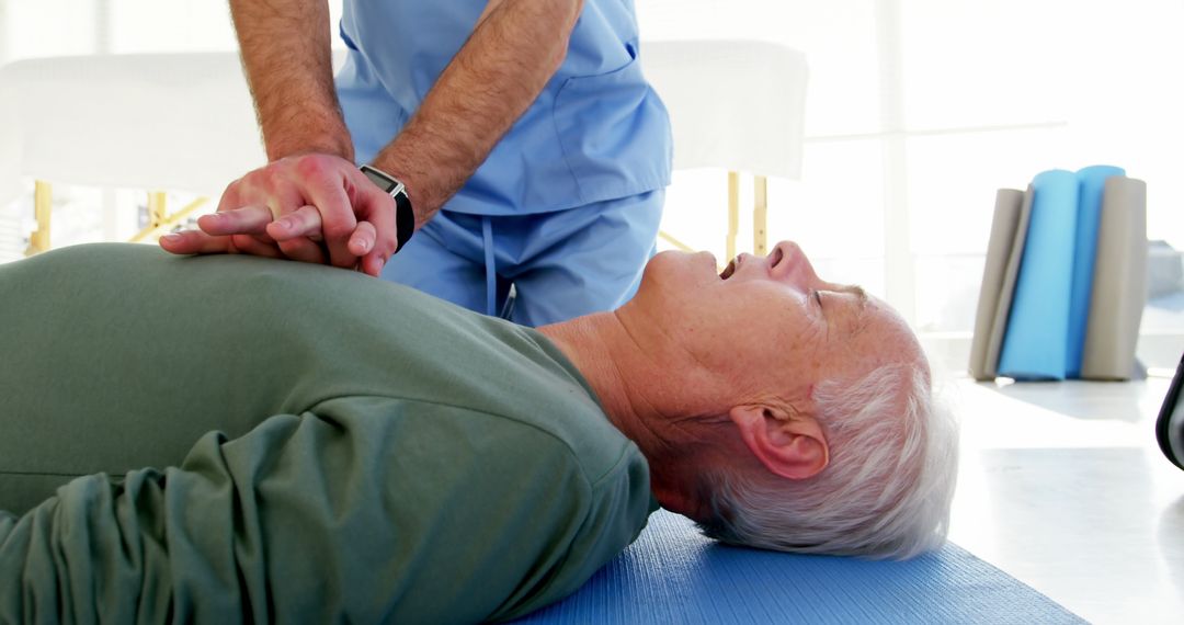 Healthcare Professional Performing CPR on Senior Man - Free Images, Stock Photos and Pictures on Pikwizard.com