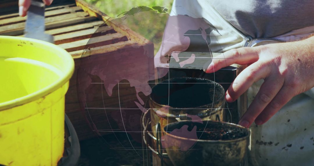 Beekeeper Tending to Beehives with Smokers at Apiary