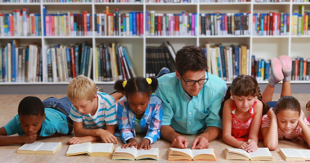 Diverse Group of Children and Teacher Reading Books in Library - Free Images, Stock Photos and Pictures on Pikwizard.com