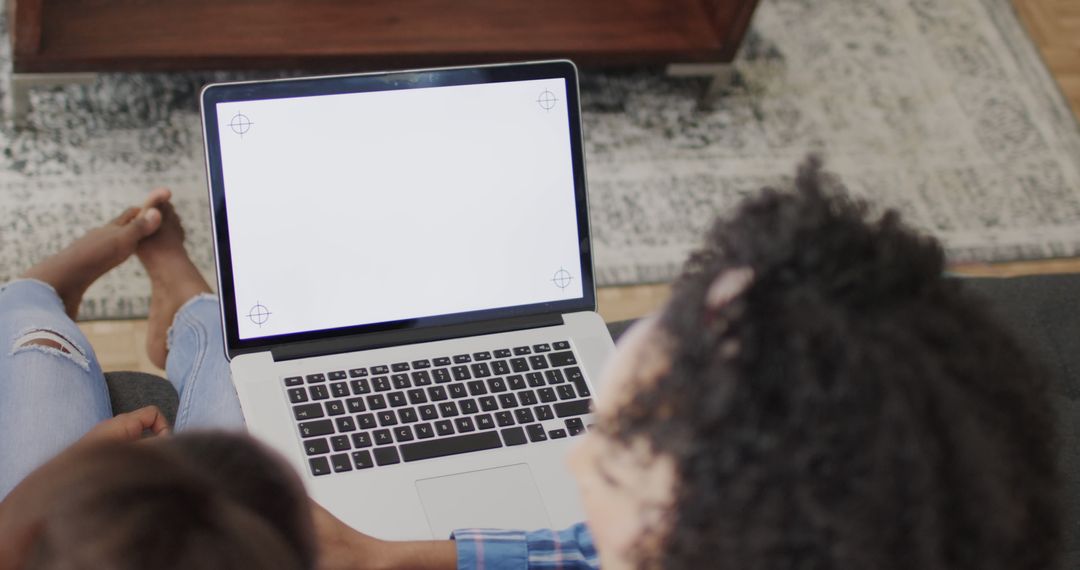 Mother and Daughter Using Laptop at Home