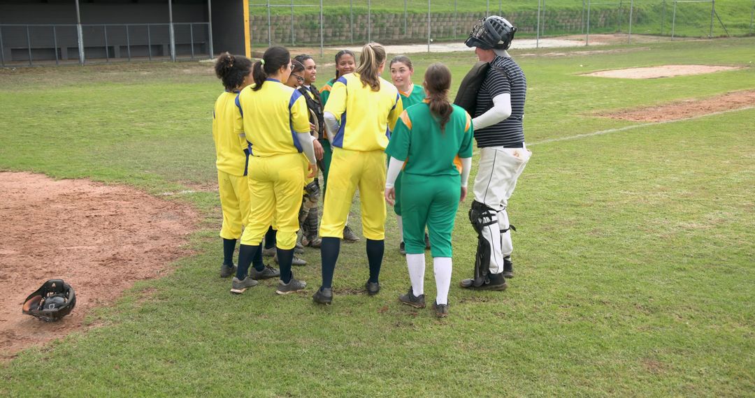 Diverse Softball Team Making Handshake in Outfield