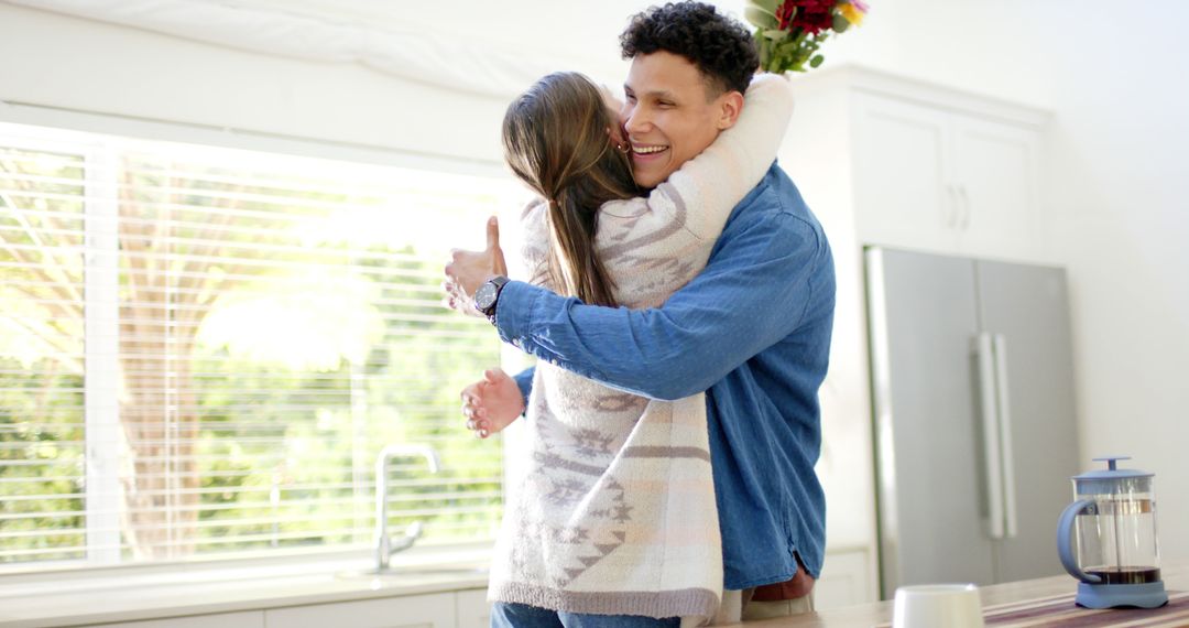 Joyful Couple Embracing at Home