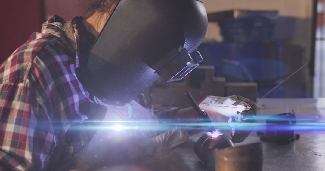 Mechanic Engaged in Precision Welding in Automotive Workshop