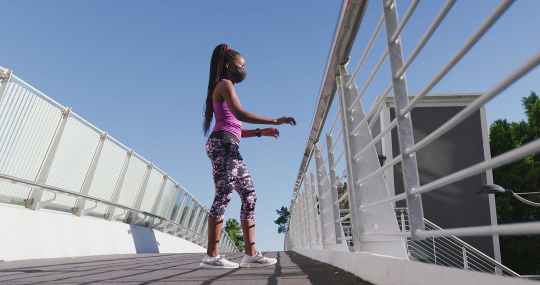 African American Woman Stretching on City Bridge During Pandemic - Free Images, Stock Photos and Pictures on Pikwizard.com