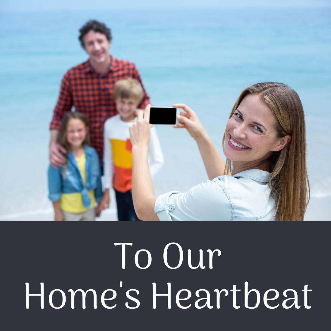 Smiling Family Capturing Memories on Beach for Mother's Day