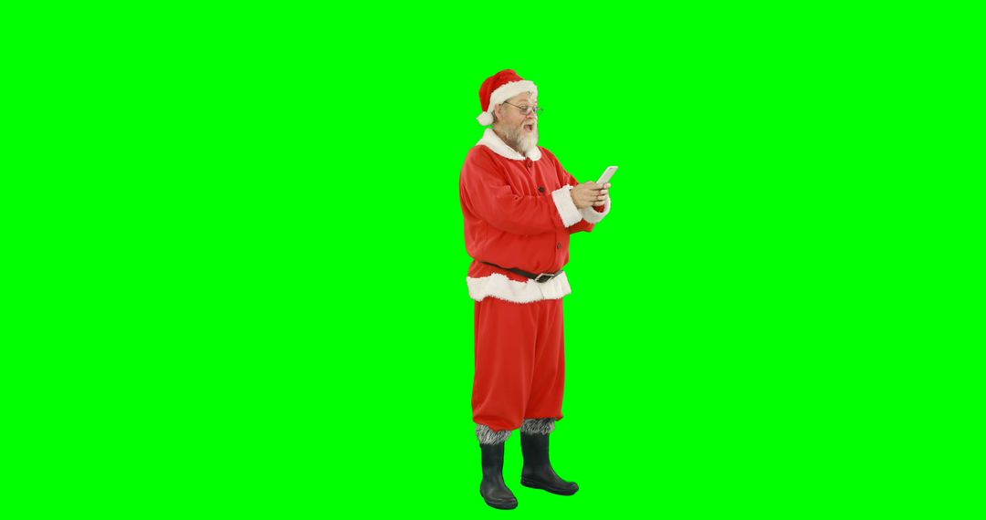 Santa Claus Texting on Mobile Phone on Green Background - Free Images, Stock Photos and Pictures on Pikwizard.com