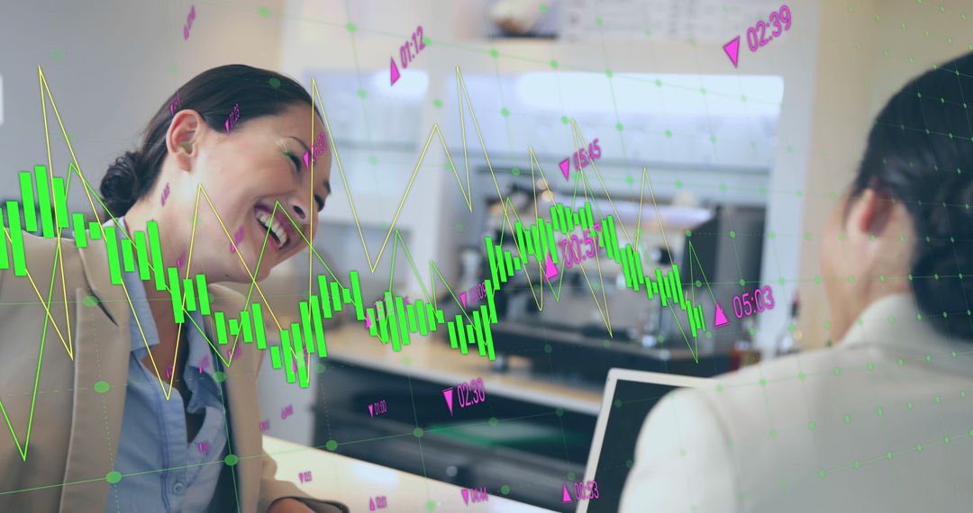 Businesswomen Analyzing Financial Graphs in Office Meeting - Free Images, Stock Photos and Pictures on Pikwizard.com