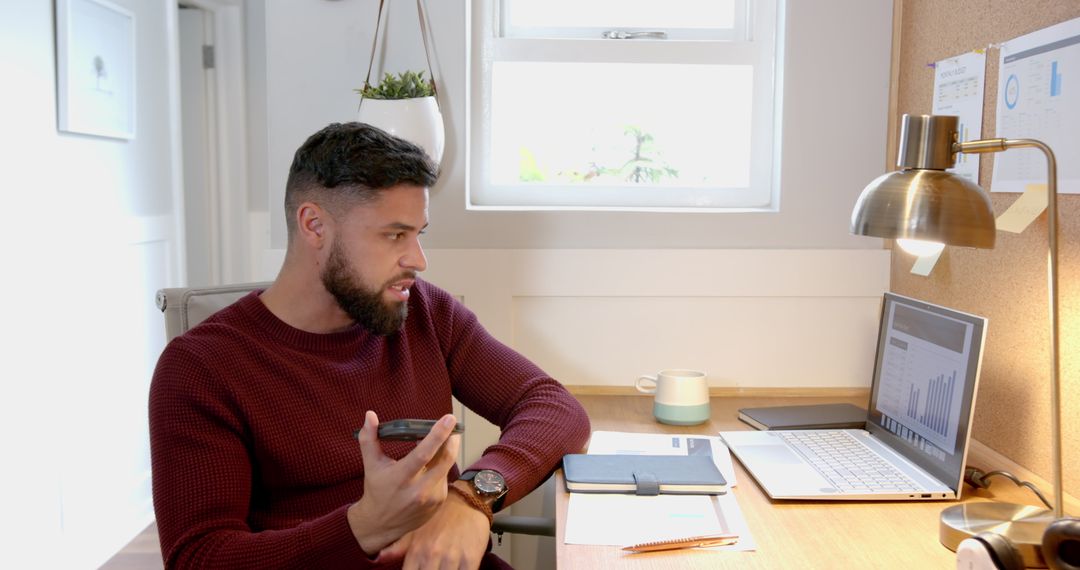 Focused Business Professional Analyzing Market Data in Home Office