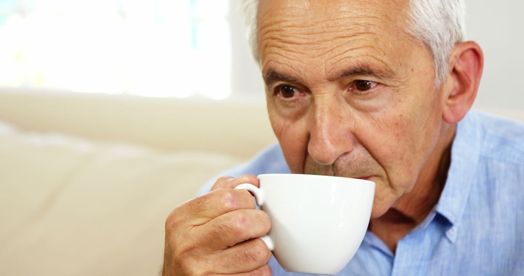 Senior Man Drinking Coffee, Enjoying A Relaxing Moment Indoors - Free Images, Stock Photos and Pictures on Pikwizard.com