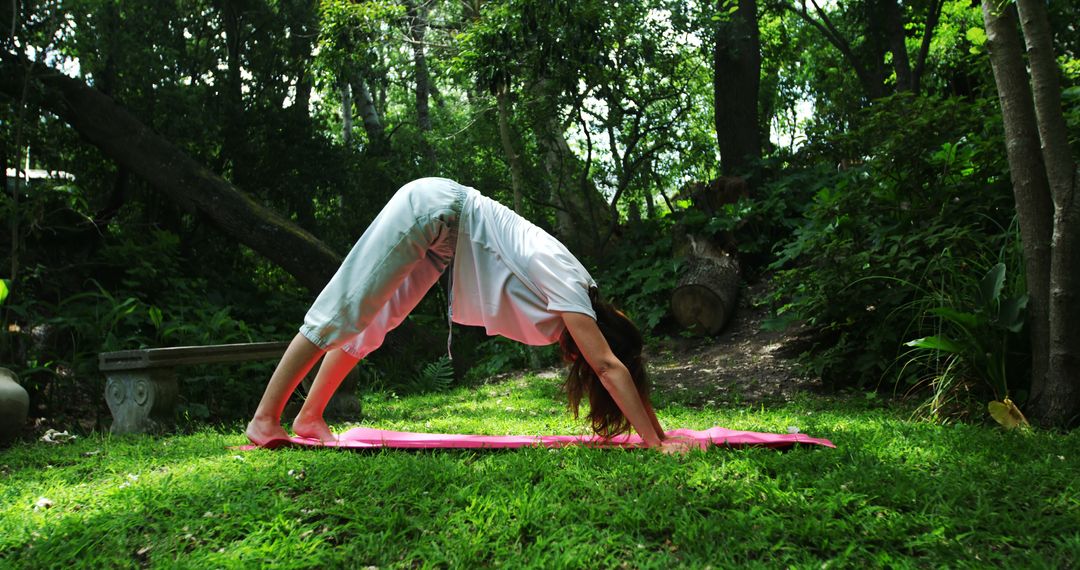 Woman Practicing Yoga in Forest, Doing Downward Dog Pose - Free Images, Stock Photos and Pictures on Pikwizard.com