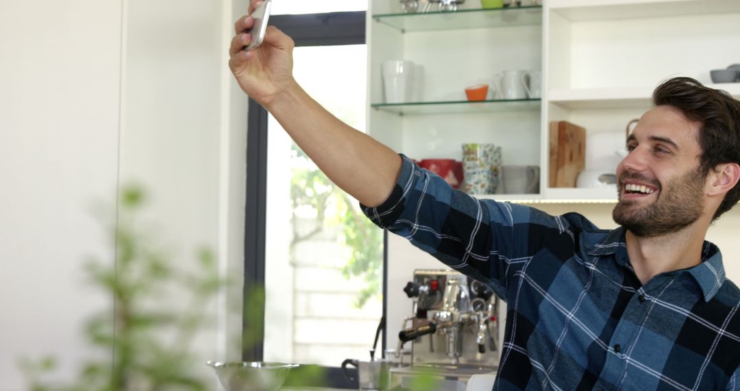 Smiling Man Taking Selfie in Home Kitchen - Free Images, Stock Photos and Pictures on Pikwizard.com