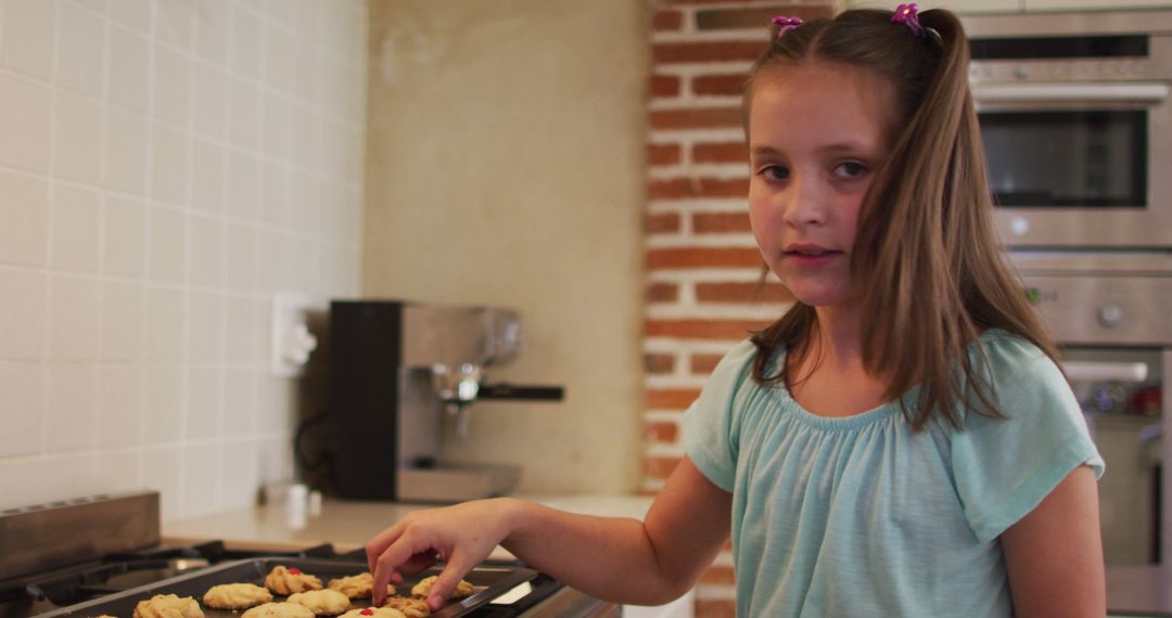 Young Girl Baking Cookies in Kitchen with Brick Wall Background - Free Images, Stock Photos and Pictures on Pikwizard.com