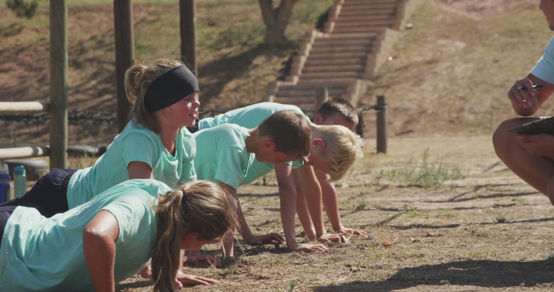 Group of Children Exercising Outdoors in Boot Camp - Free Images, Stock Photos and Pictures on Pikwizard.com