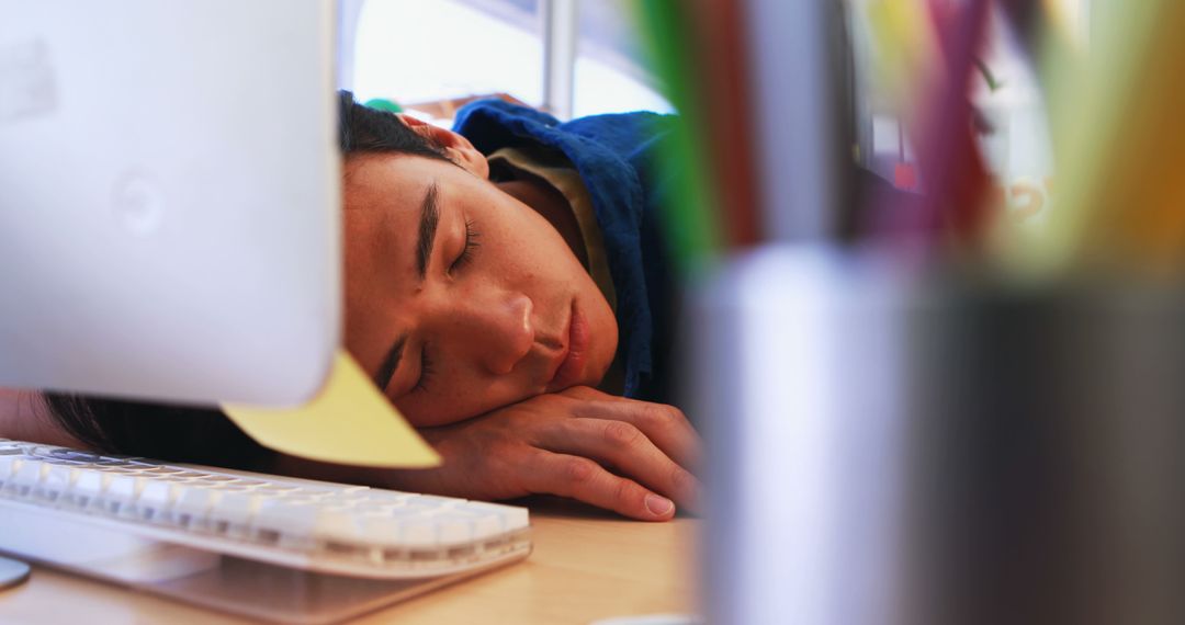 Exhausted Person Sleeping at Office Desk During Work - Free Images, Stock Photos and Pictures on Pikwizard.com