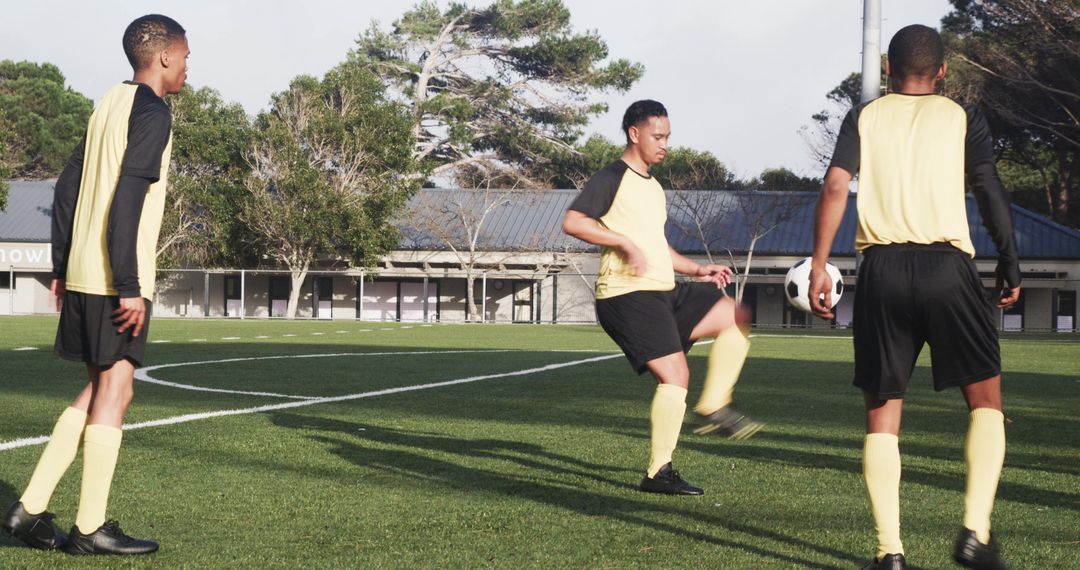 Soccer Players Practicing Passing Drills on Grass Field