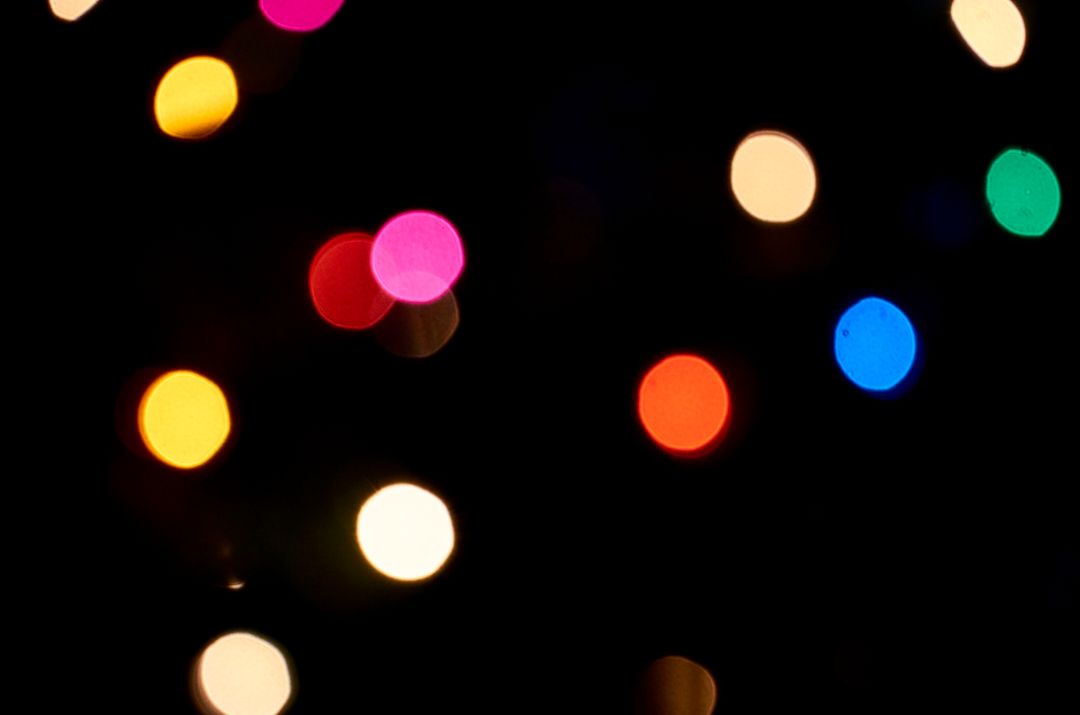Vibrant Multicolored Bokeh Lights Against Dark Background