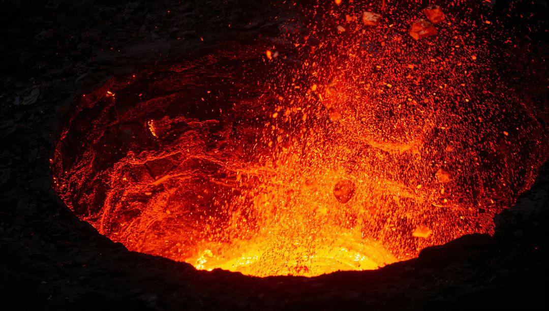 Volcanic Lava Erupting with Fiery Splashes in Crater