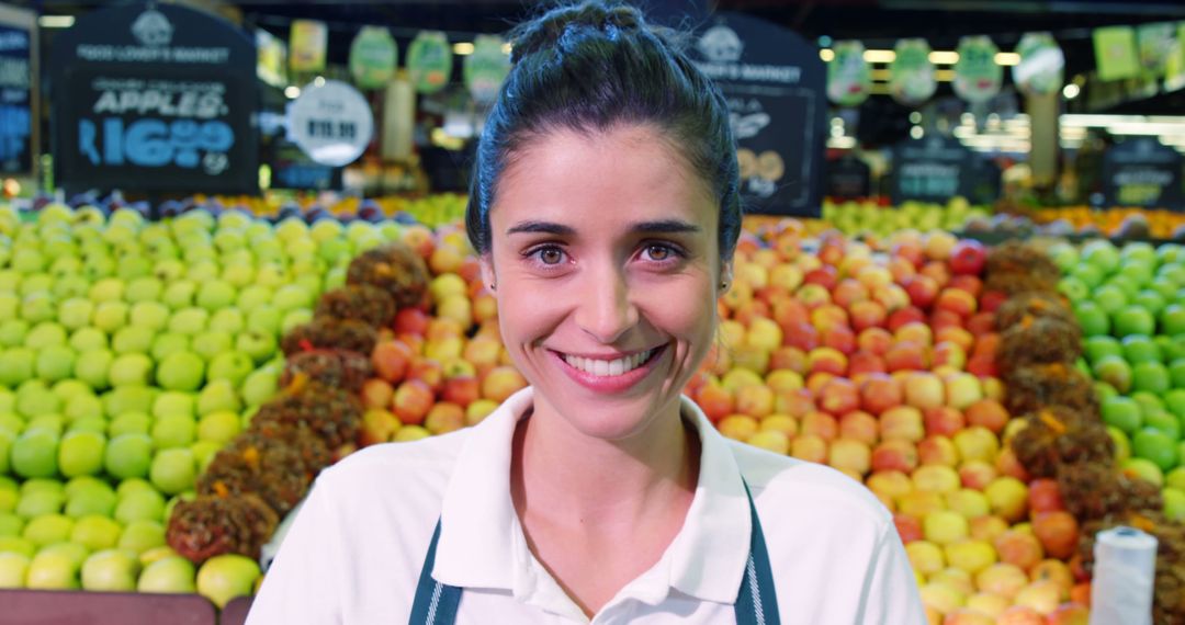 Smiling Female Grocery Store Worker in Produce Section - Free Images, Stock Photos and Pictures on Pikwizard.com